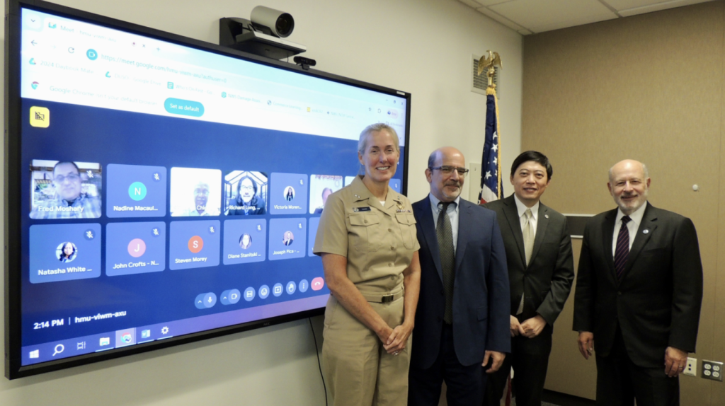 Vice Admiral Nancy Hann, Ben Friedman, Sen Chiao, and Rick Spinrad at the signing of a  Letter of Intent between NOAA and the Educational Partnership Program wi