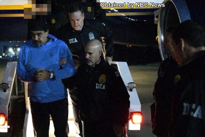 Nicolás Maduro being escorted by the DEA